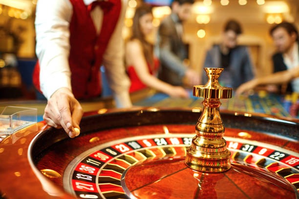 Live blackjack dealer hands dealing cards at a professional table